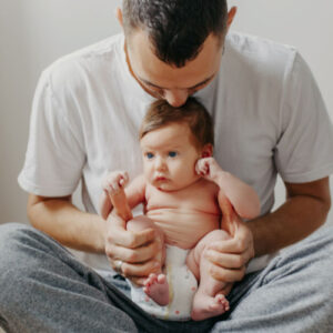 Dad with baby on his lap