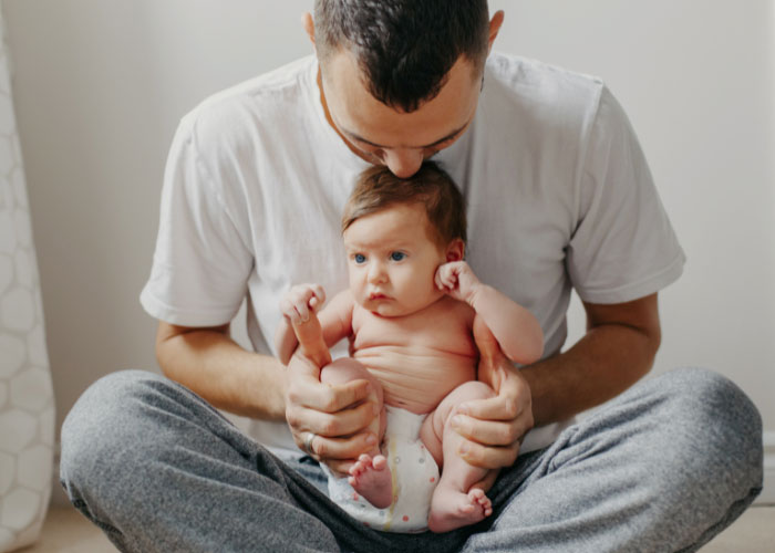 Dad with baby on his lap