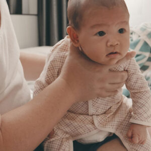 dad burping infant baby