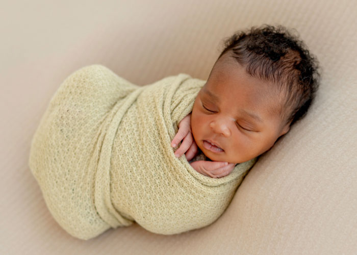 swaddled sleeping baby